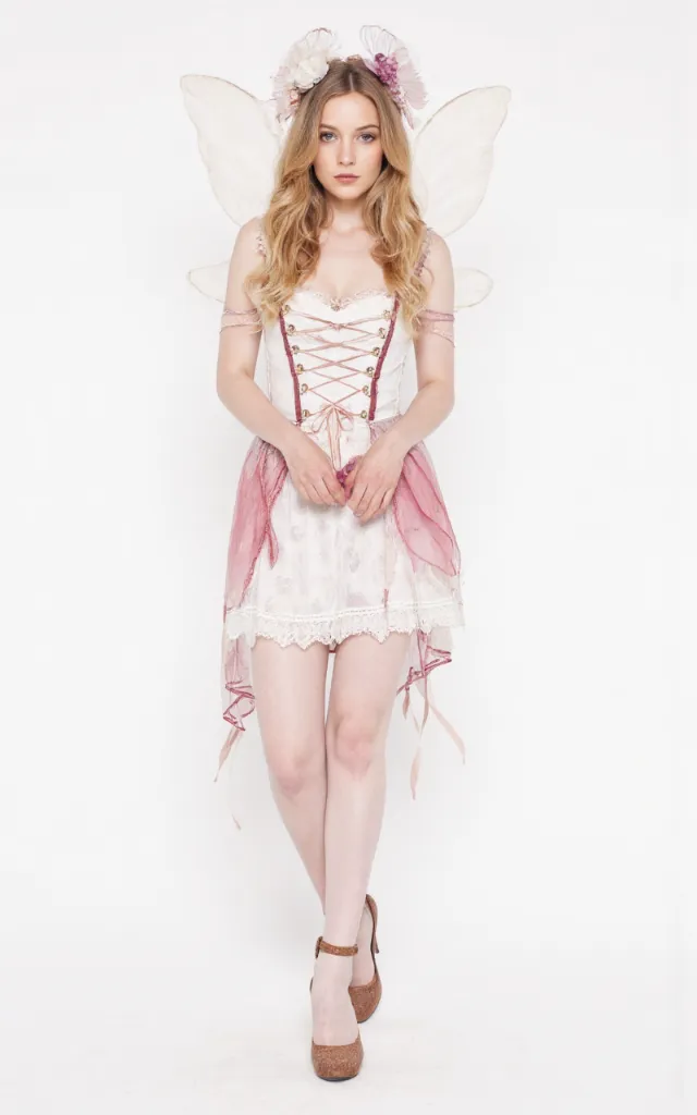 A French female model wearing Fairy   like   style clothing, against a white background, in a front   facing shot focusing on shoes